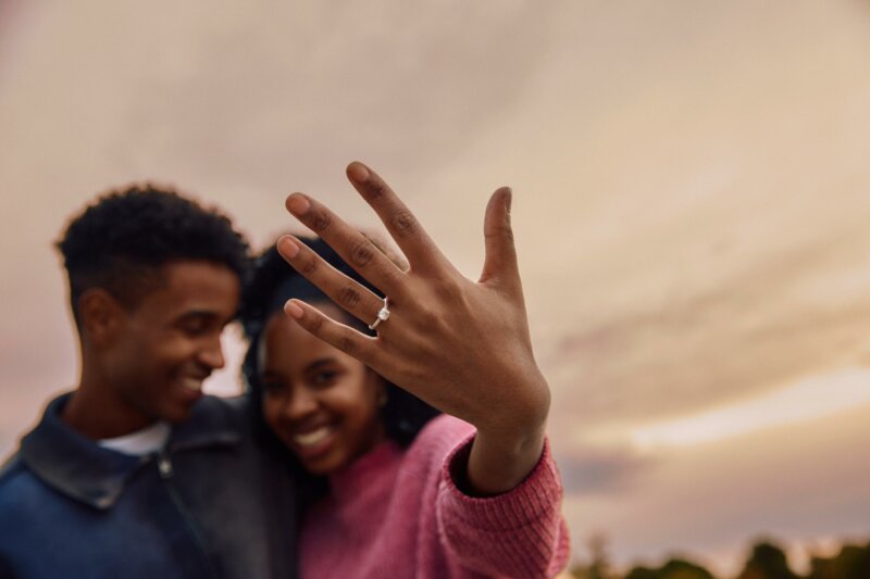 Engaged couple showing hand