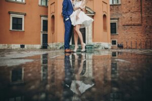 Married couple reflected in a puddle