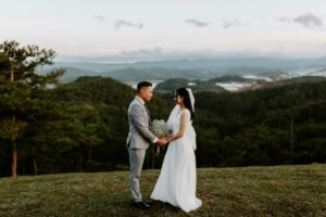 Couple exchanging wedding vows outside