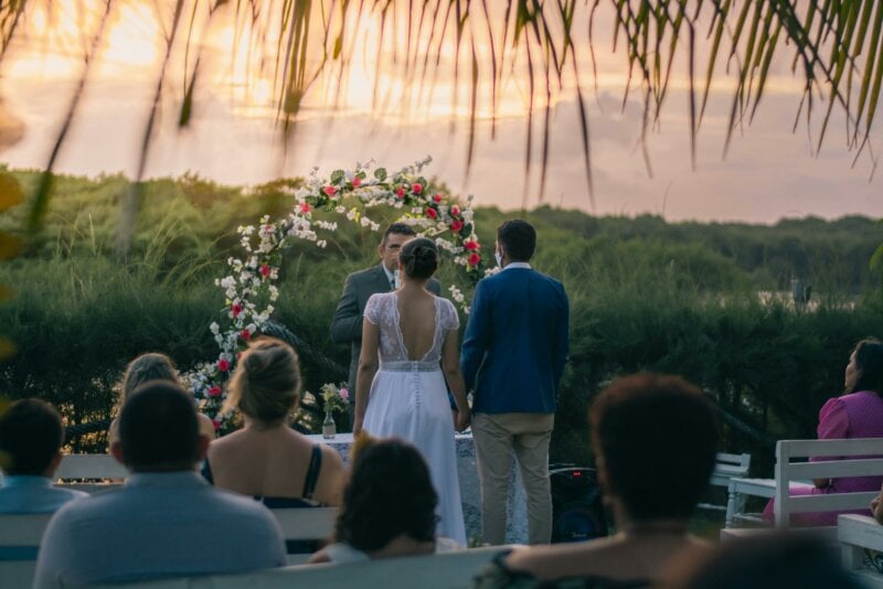 Back of a couple getting married outside 