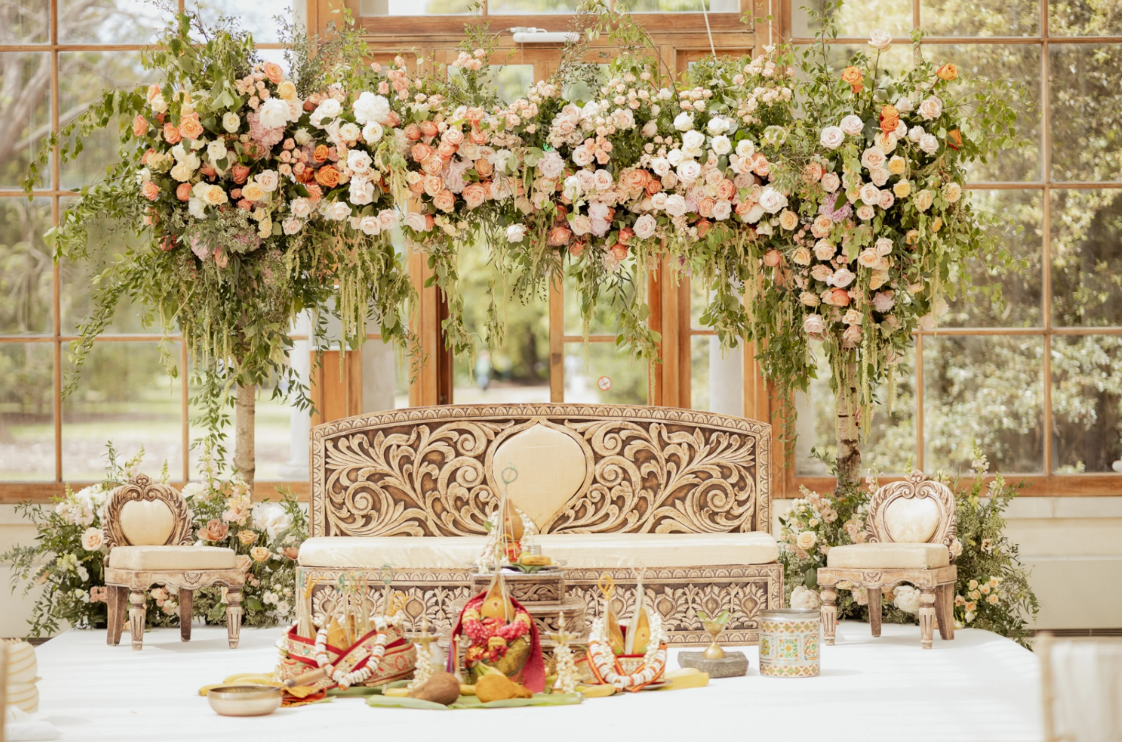 Floral arrangement around chairs of a wedding ceremony
