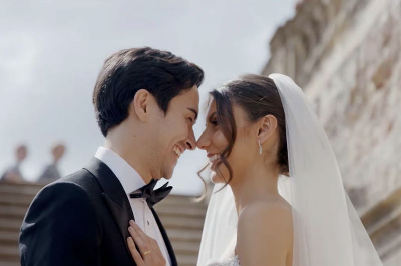 Wedded couple smiling and looking deep into each other's eyes in wedding video