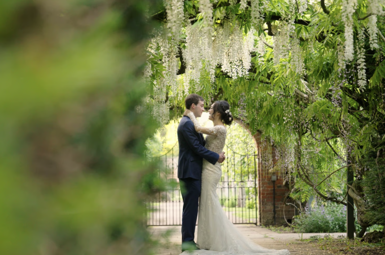 Candid shot of wedded couple embracing outdoors in a wedding video