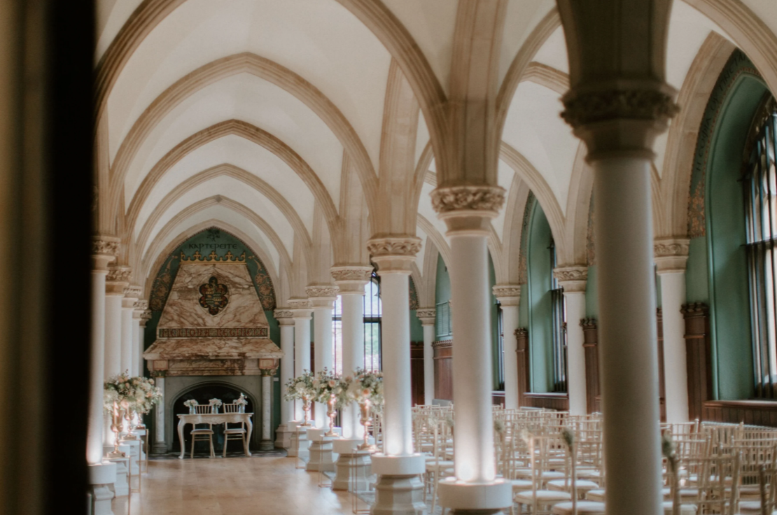 Ceremony space inside a UK wedding venue showing tall pillars and arches