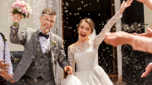 Bride and groom just married with confetti in the air