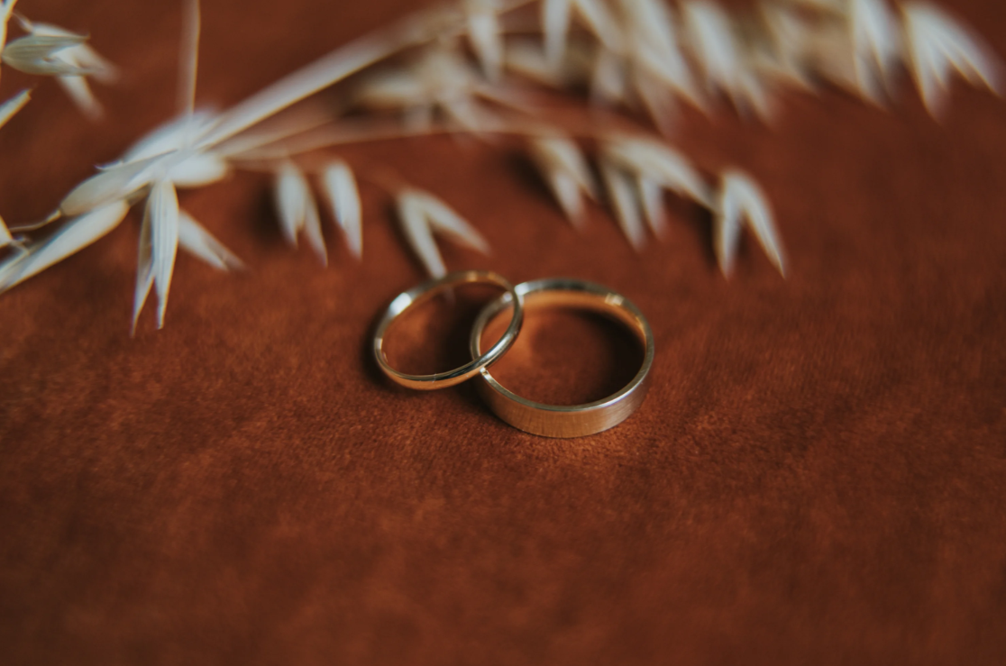 Two wedding bands laid out on a table