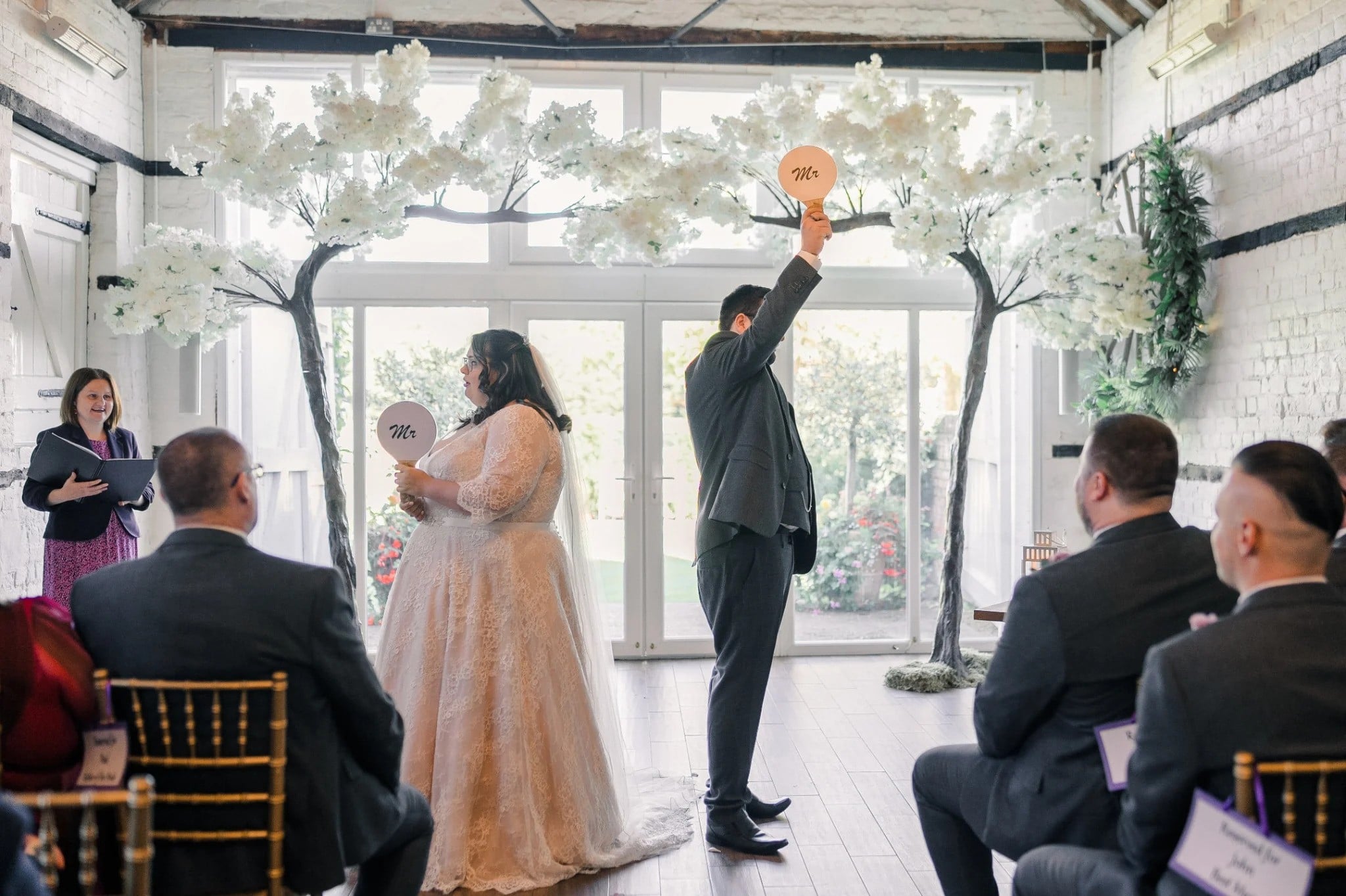 A wedding celebrant conducting a game of mr and mrs during a wedding ceremony