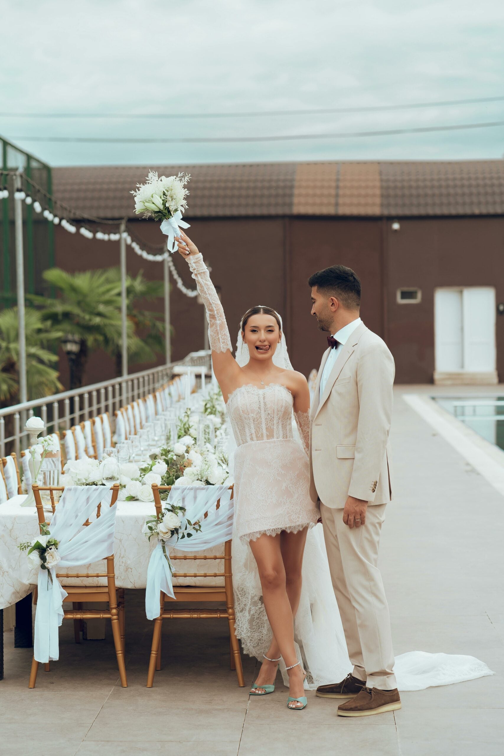 Bride and groom celebrating at a wedding reception