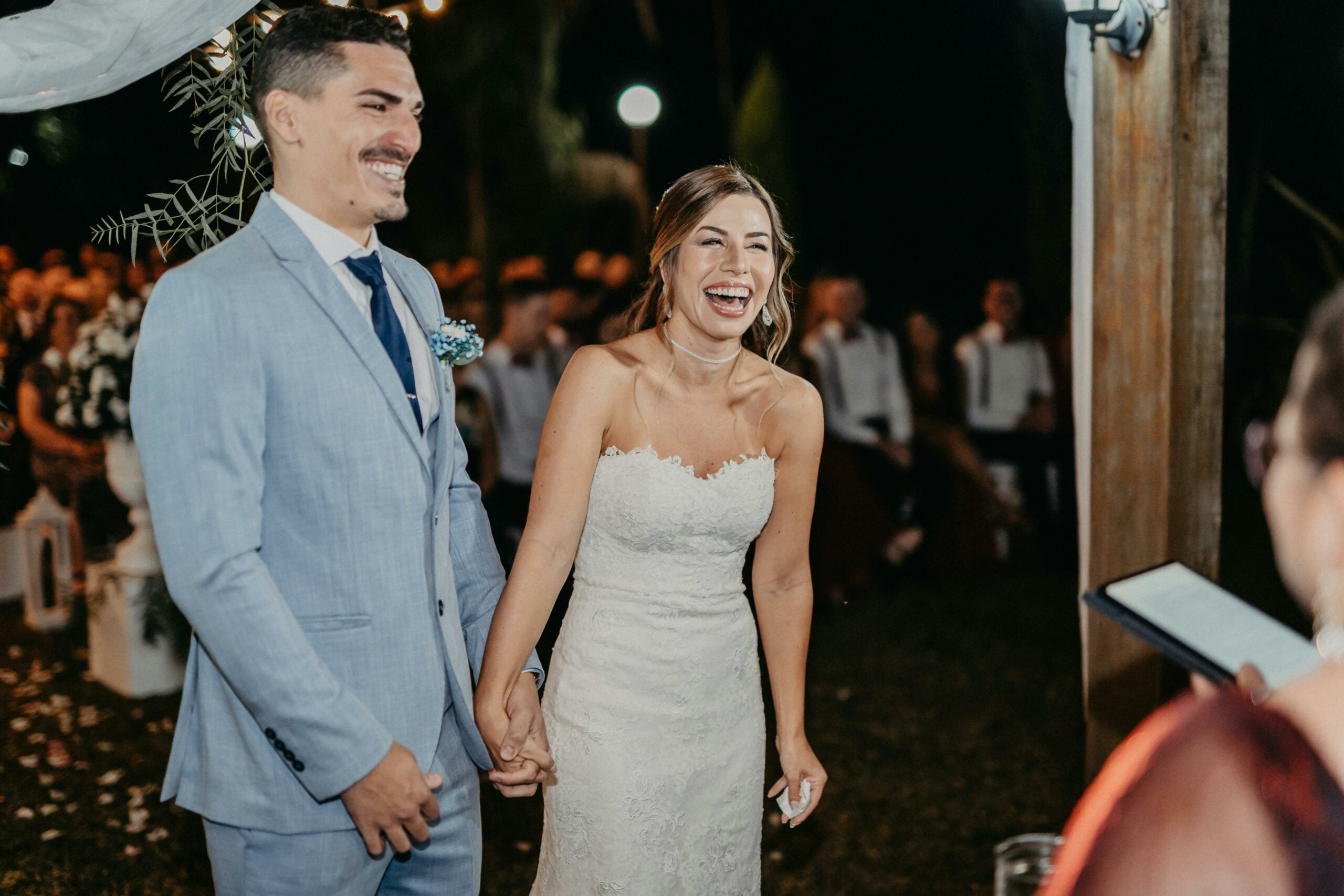 Bride and groom laughing during their wedding ceremony