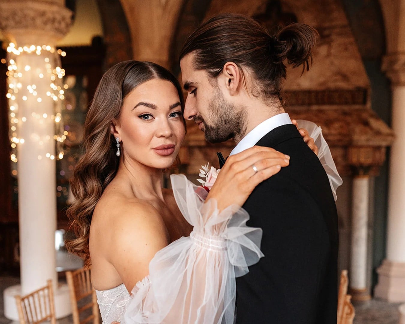 Newly wedded couple posing for a photo