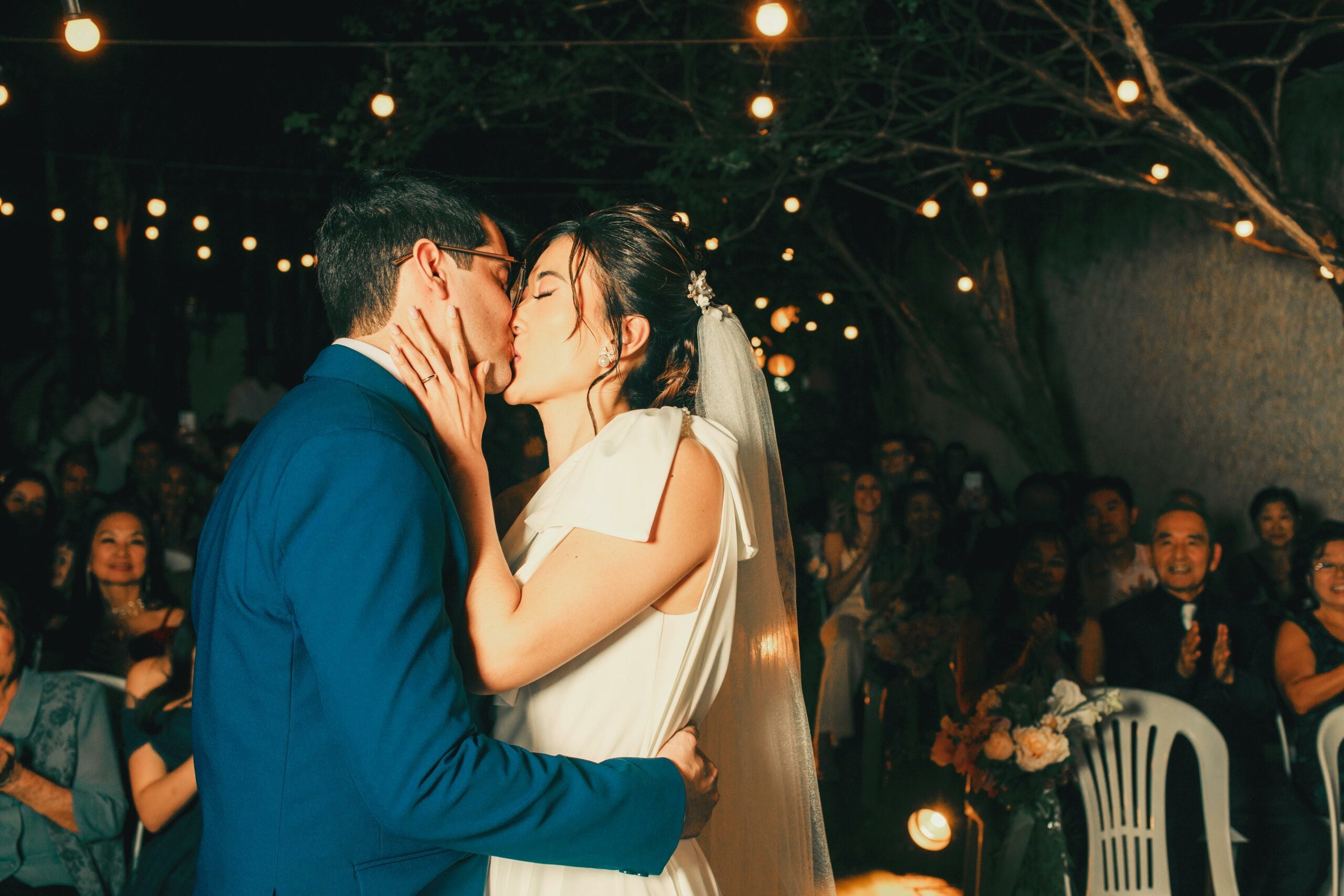 Bride and groom kissing at a wedding