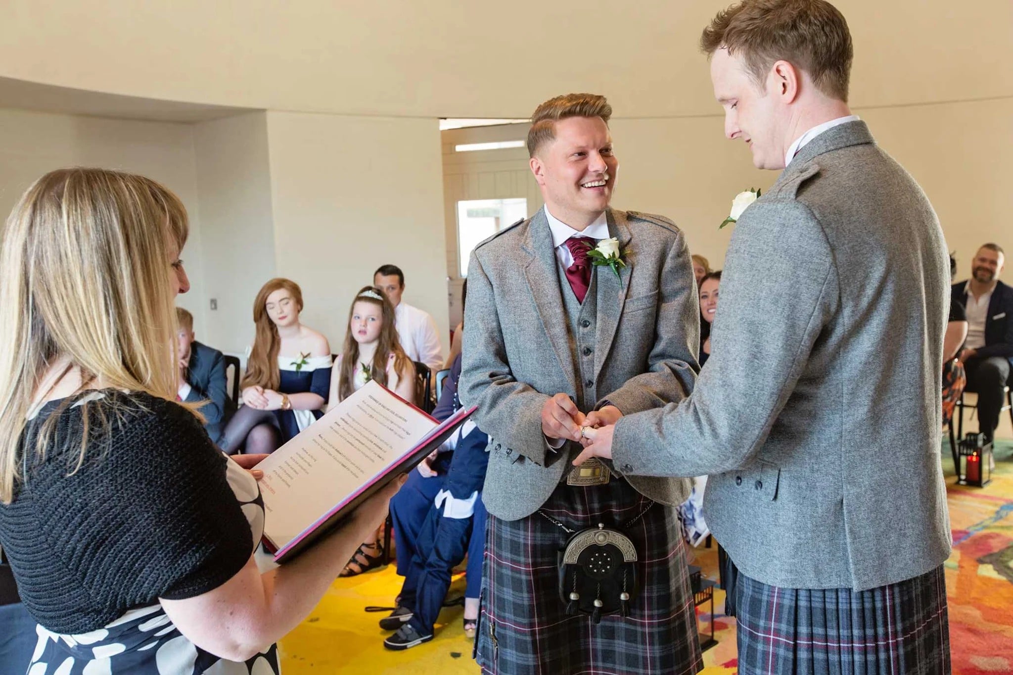 Wedding celebrant conducting a same-sex wedding