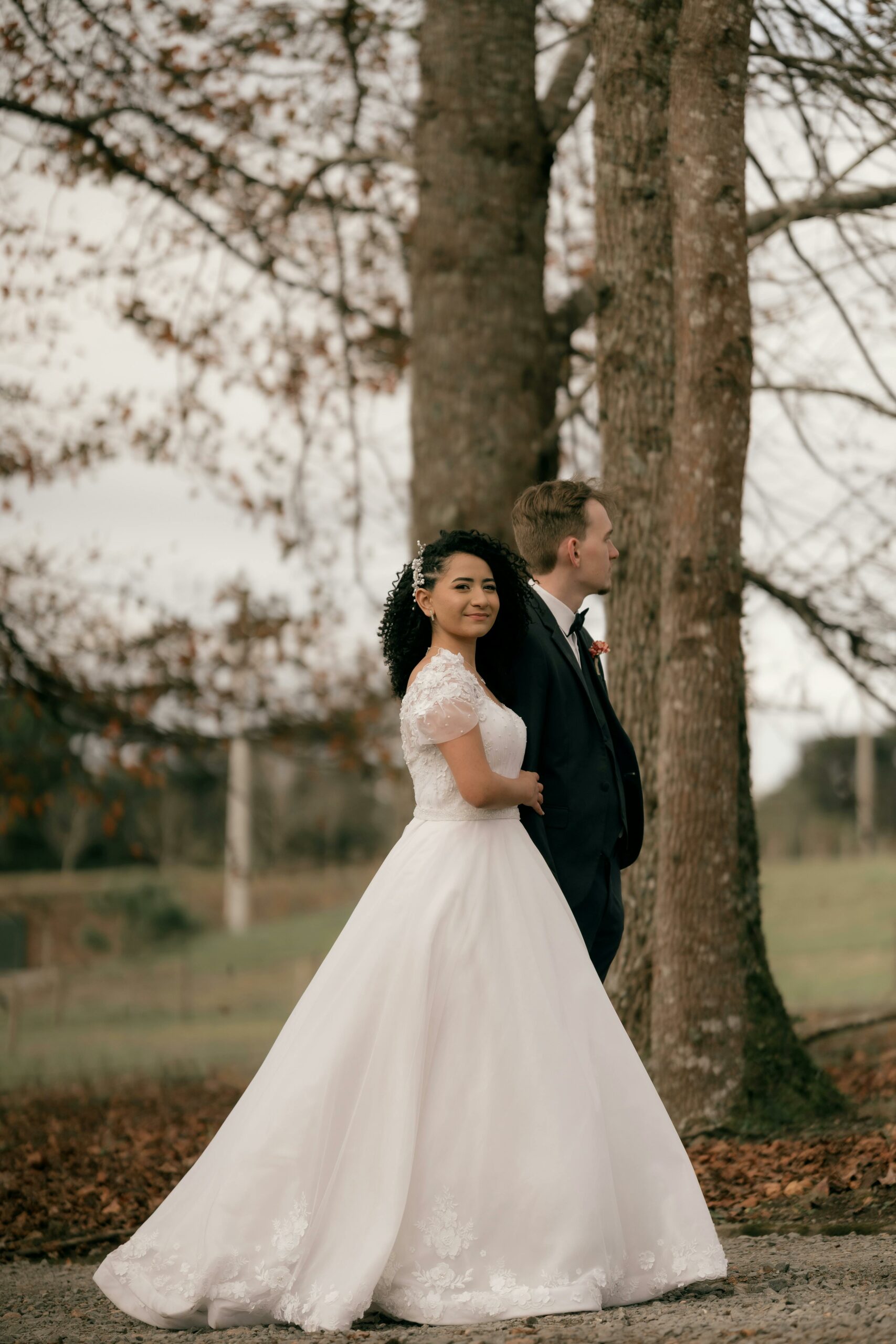 Bride and groom walking outdoors at a wedding