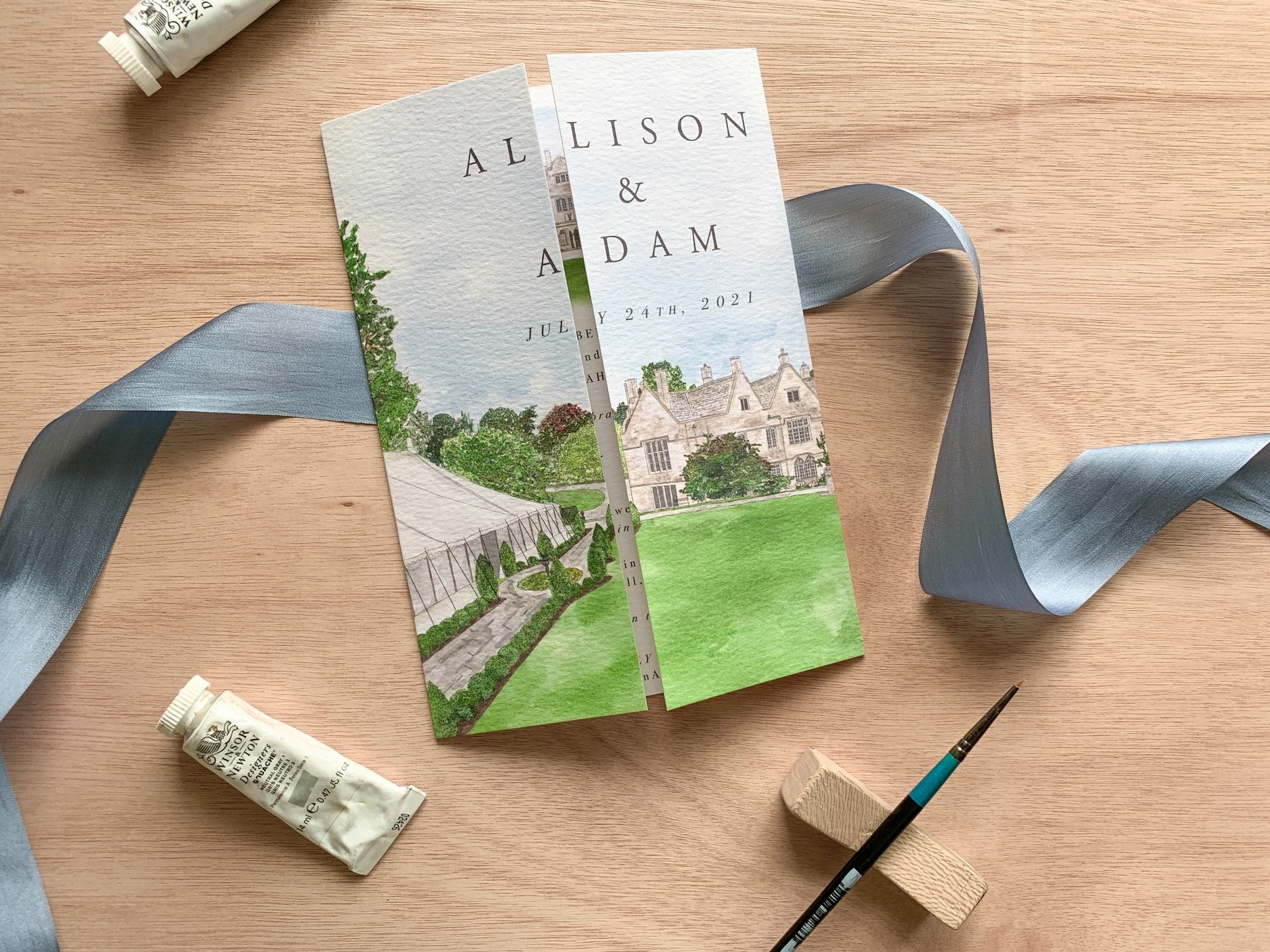 a watercolour wedding invitation depicting the couple's wedding venue
