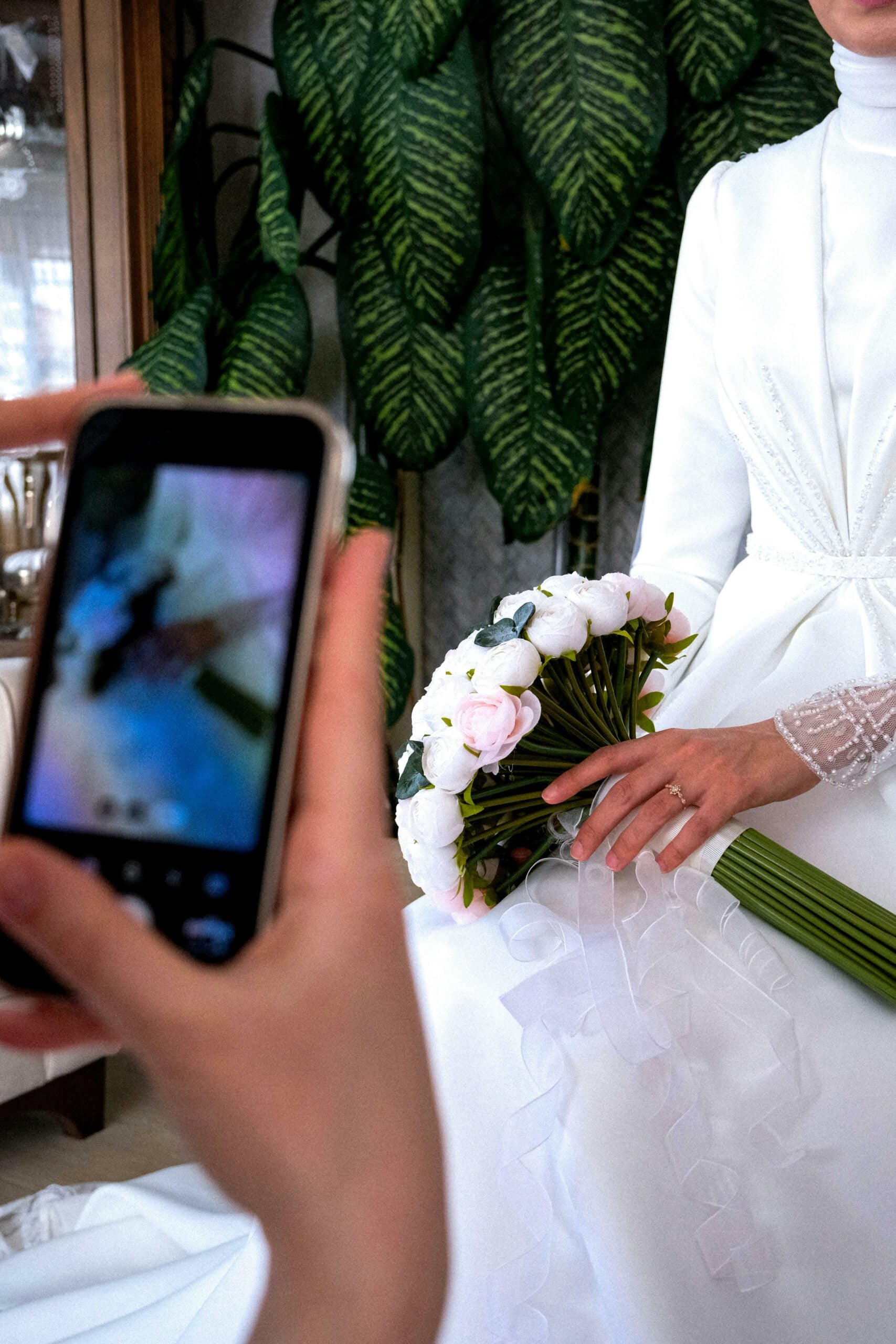 Details being filmed by a content creator at a wedding