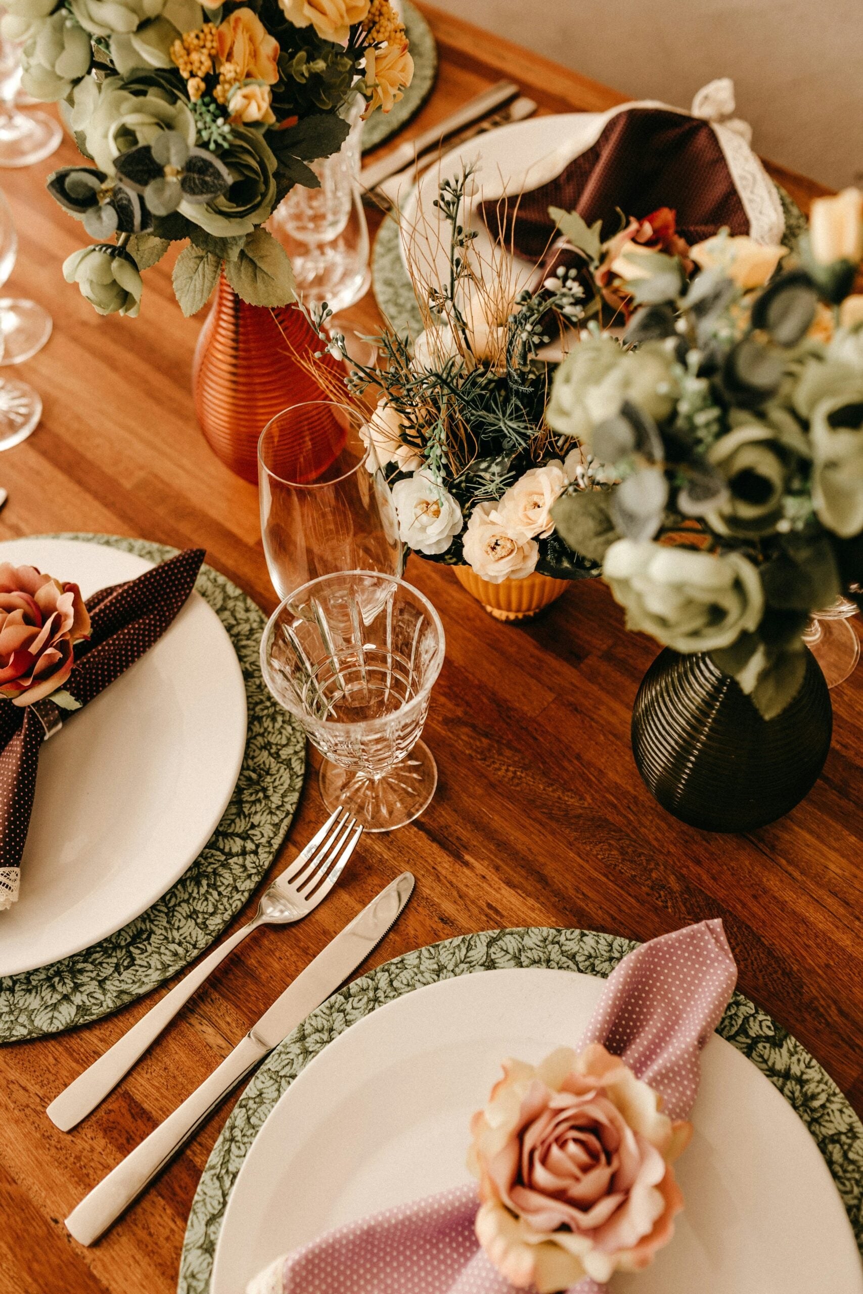 Wedding reception table decorated with floral centrepieces