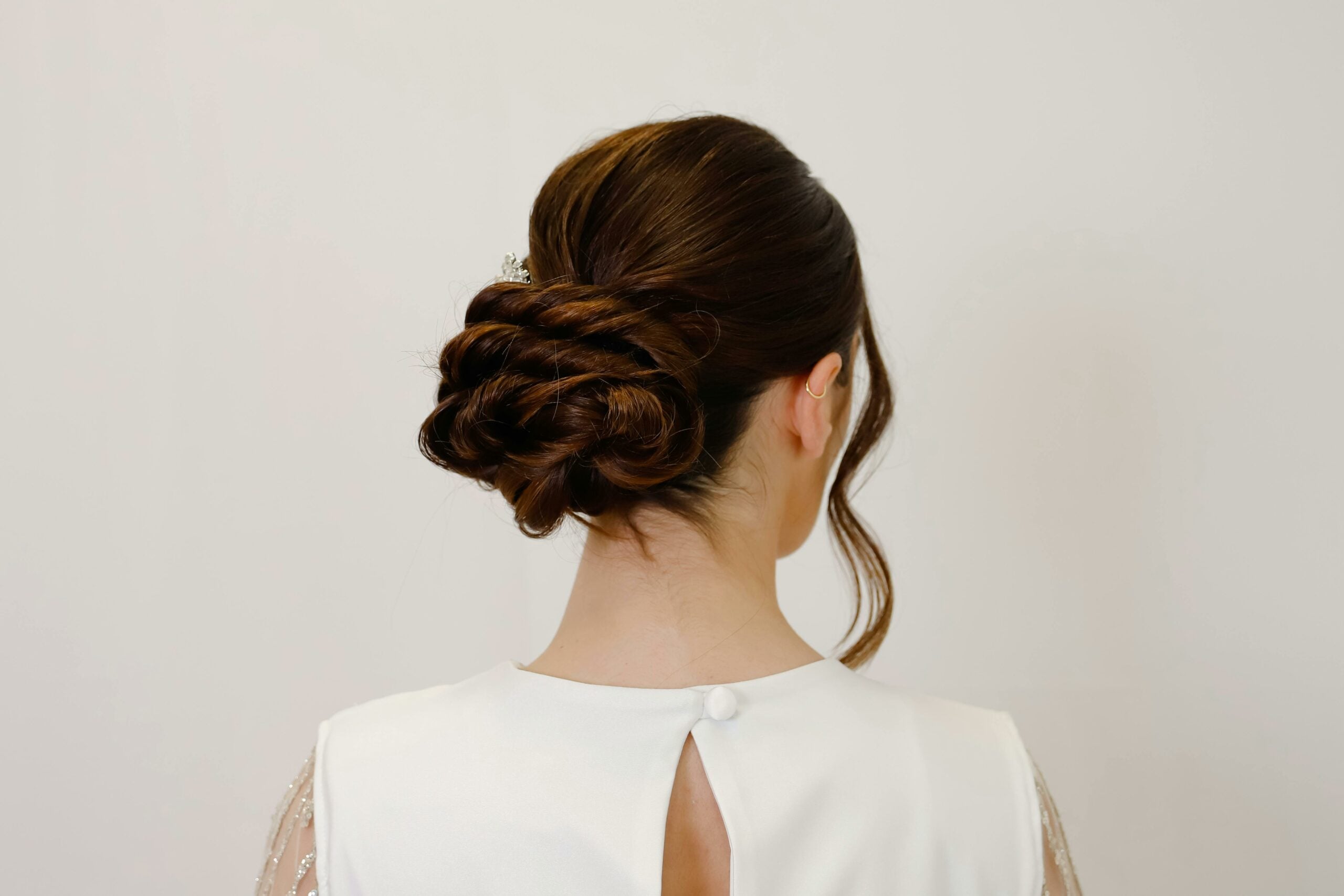 the back of a woman showing off her low bun hairstyle
