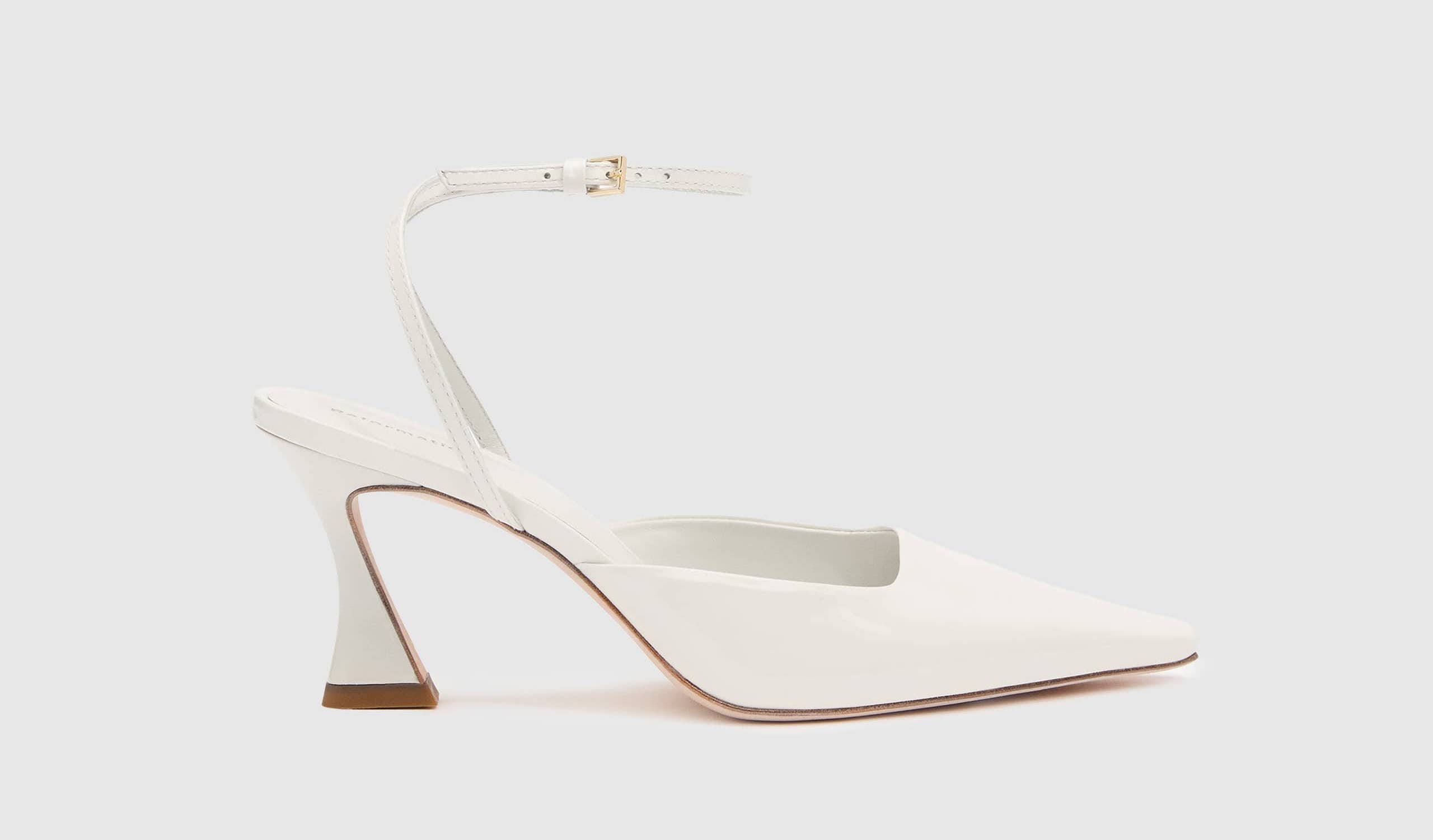 a white leather pointed slingback pump with ankle strap