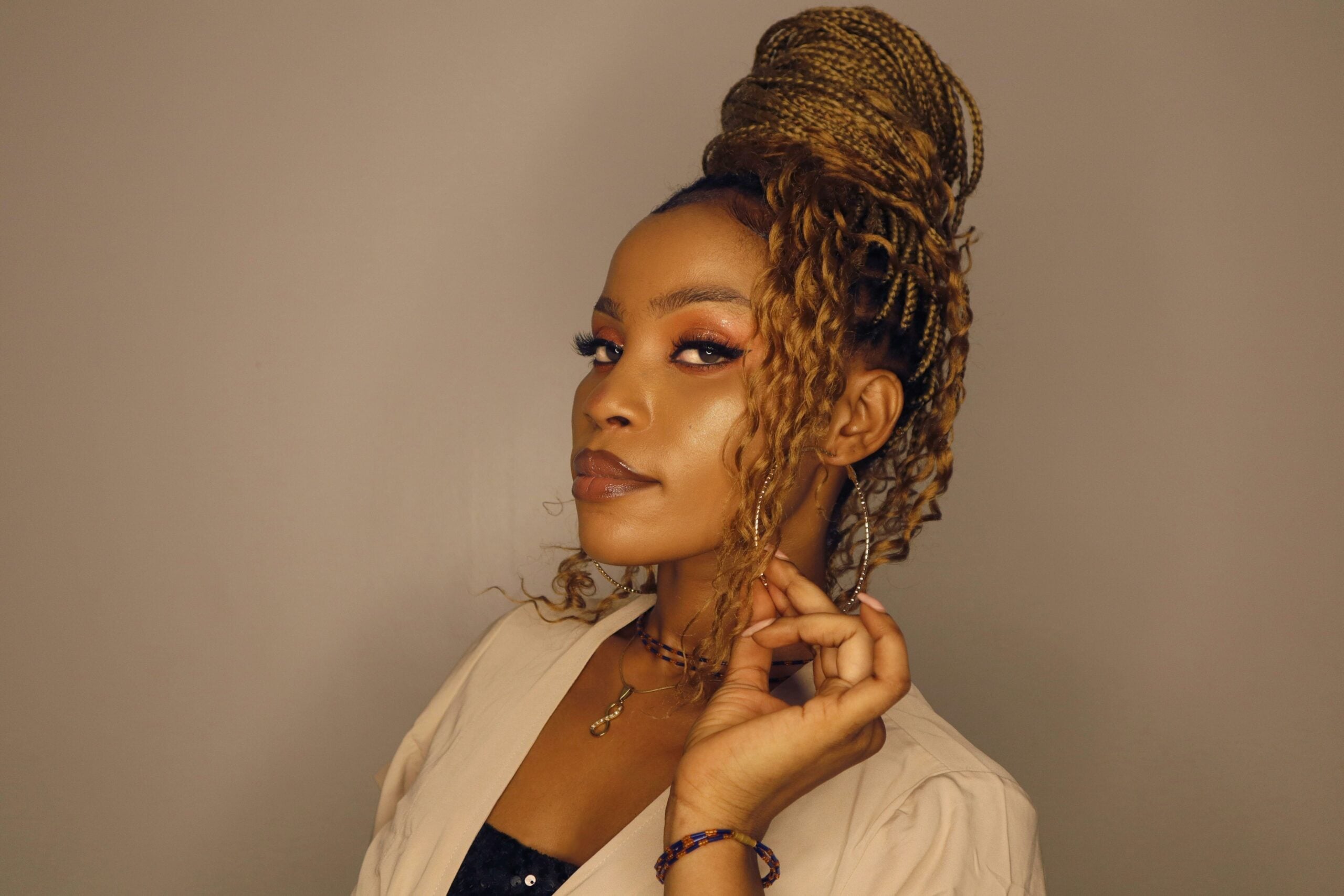 woman with braided hair in a bun