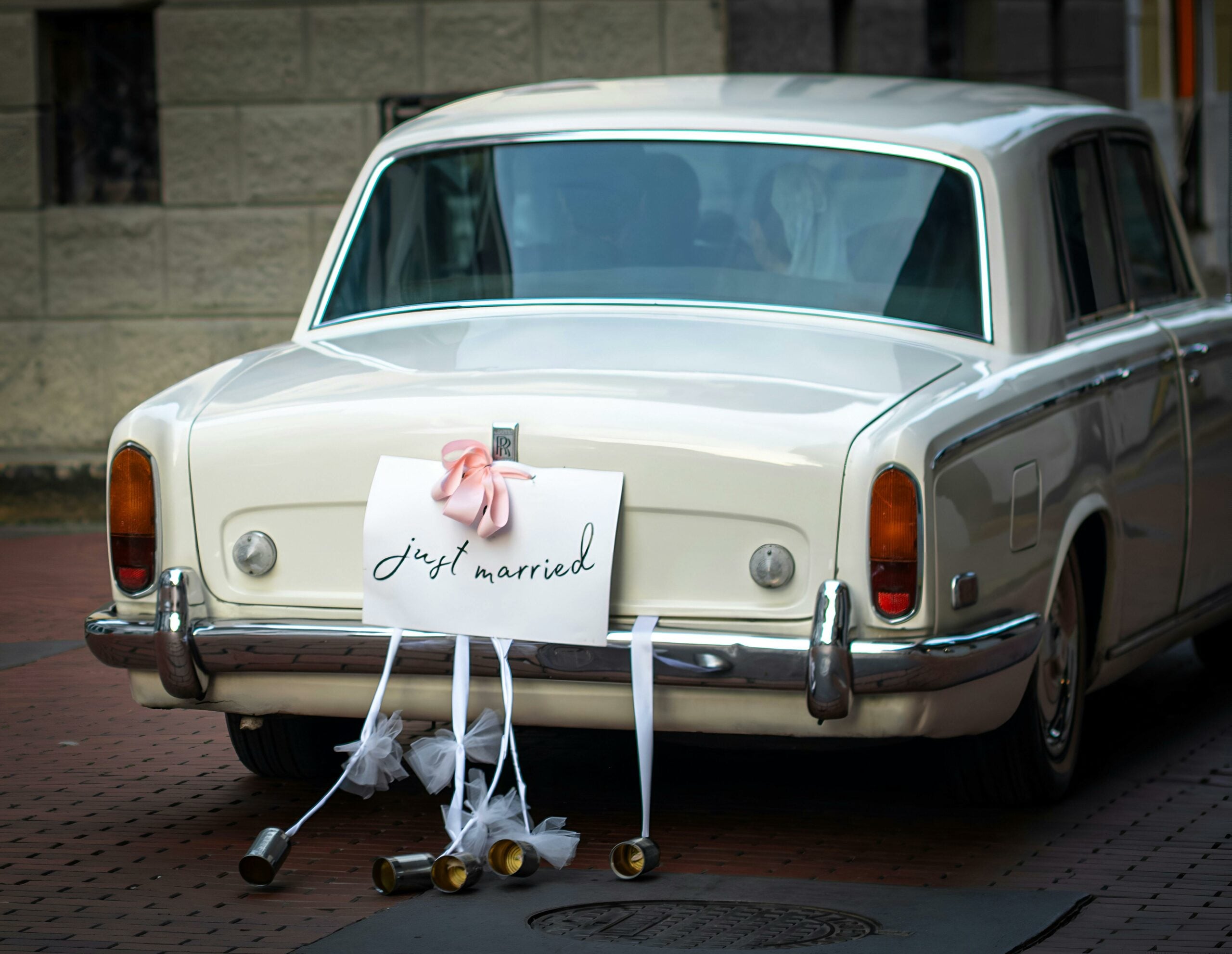 Vintage wedding car decorated with a 'just married' sign