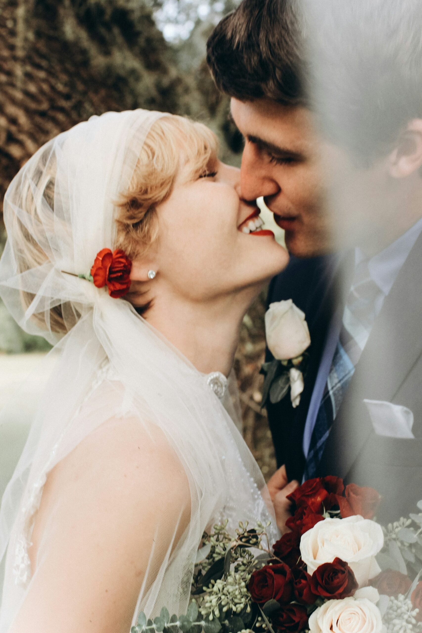 Bride and groom kissing at a romantic wedding ceremony