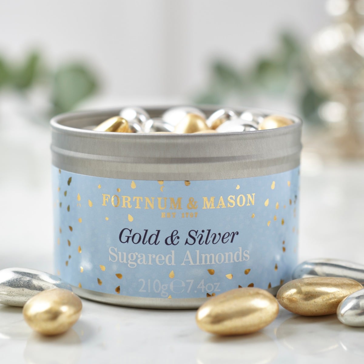 Tub of gold and silver metallic sugared almonds