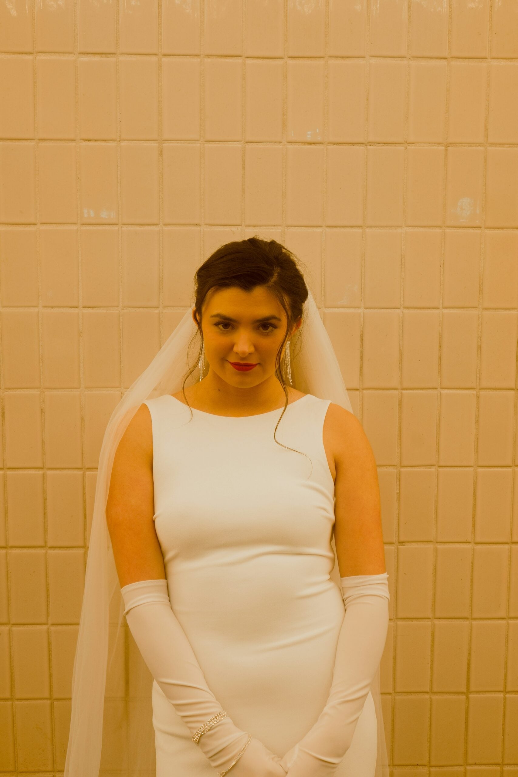 Bride wearing elbow length satin opera gloves