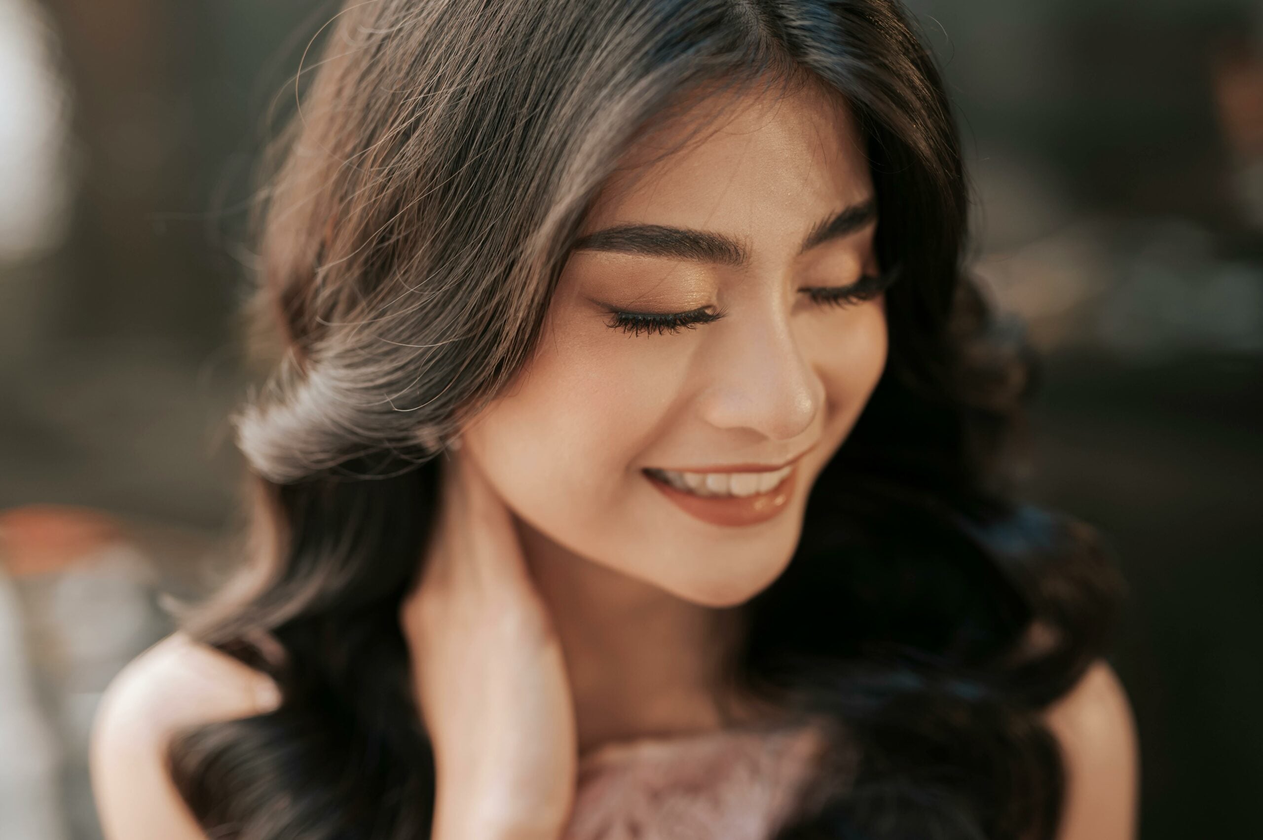 Close up shot of asian woman with hollywood curls