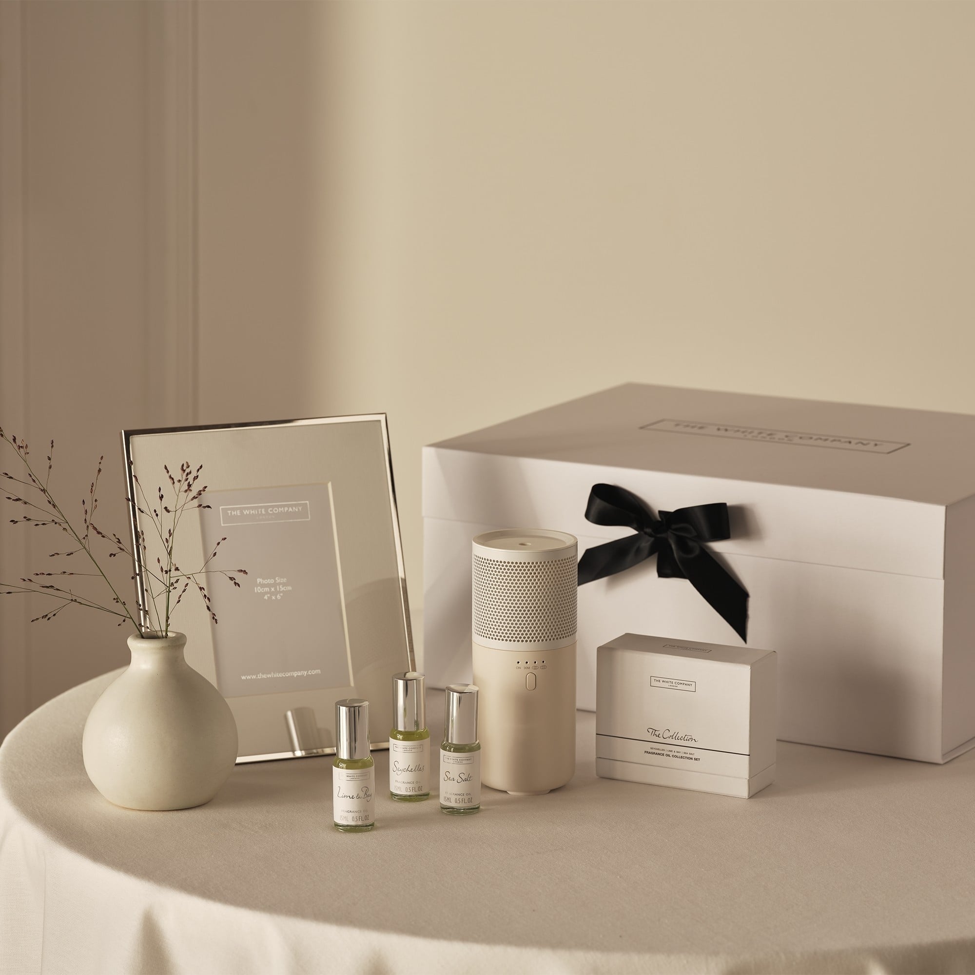 gift set with oil diffuser and a silver photo frame