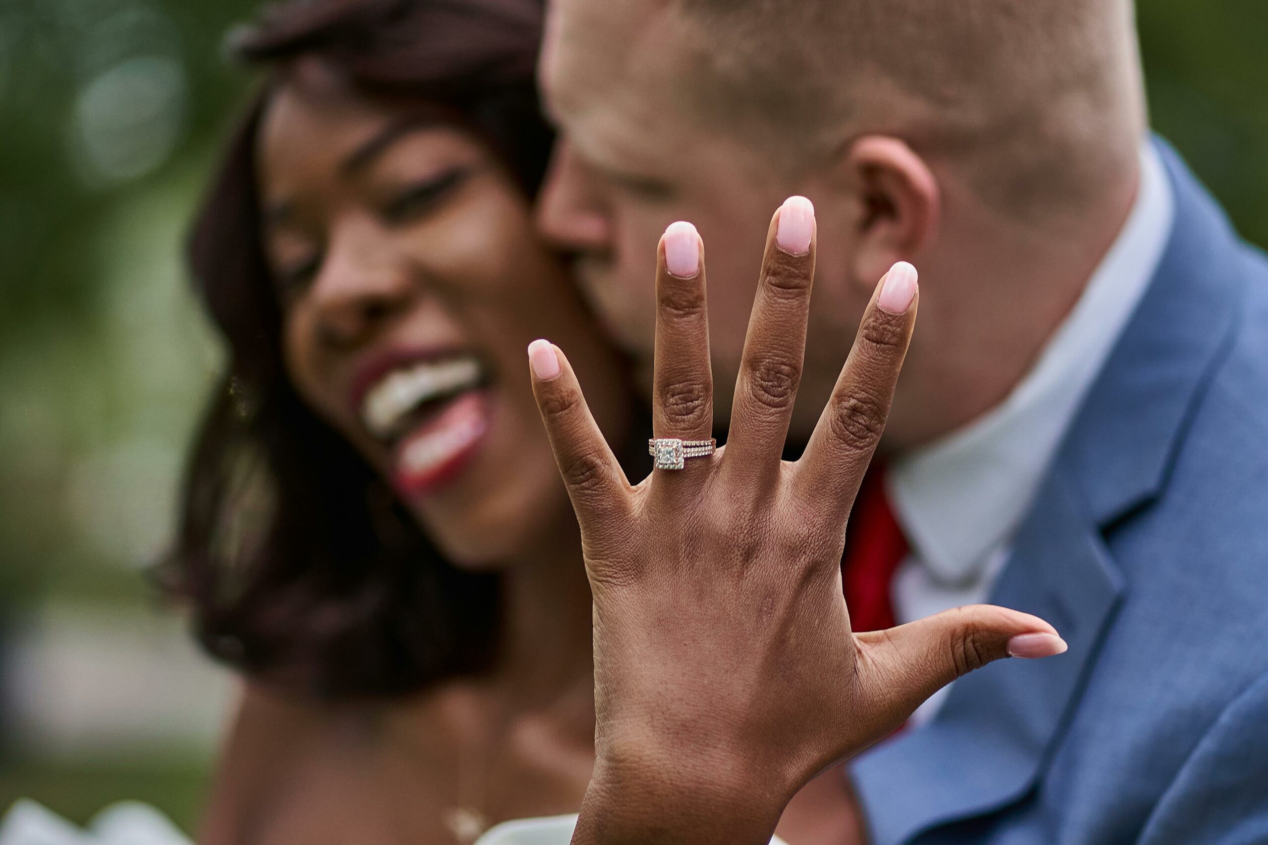 couple showing off engagement ring