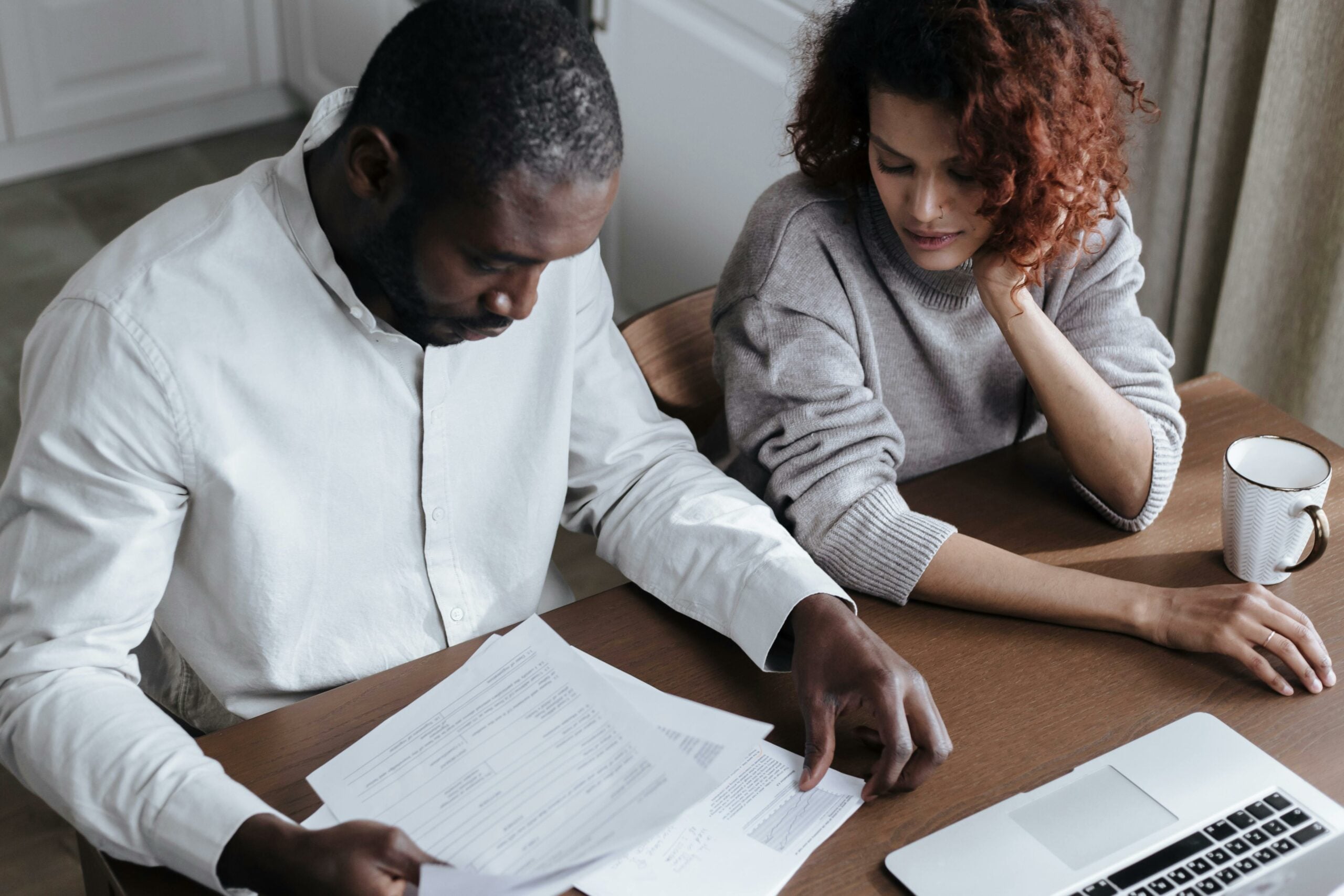 Couple reviewing paperwork together