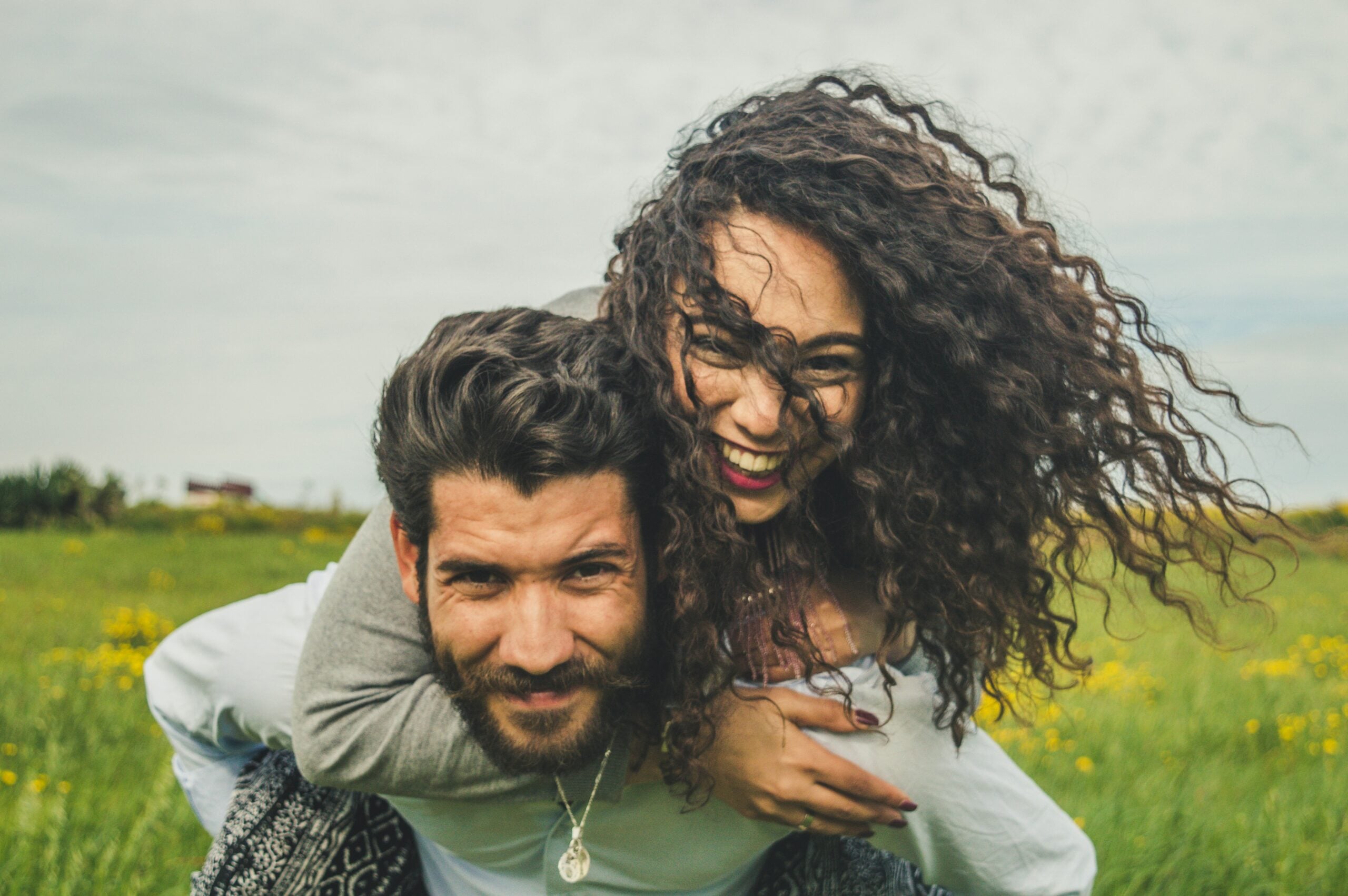 a man giving a woman a piggyback