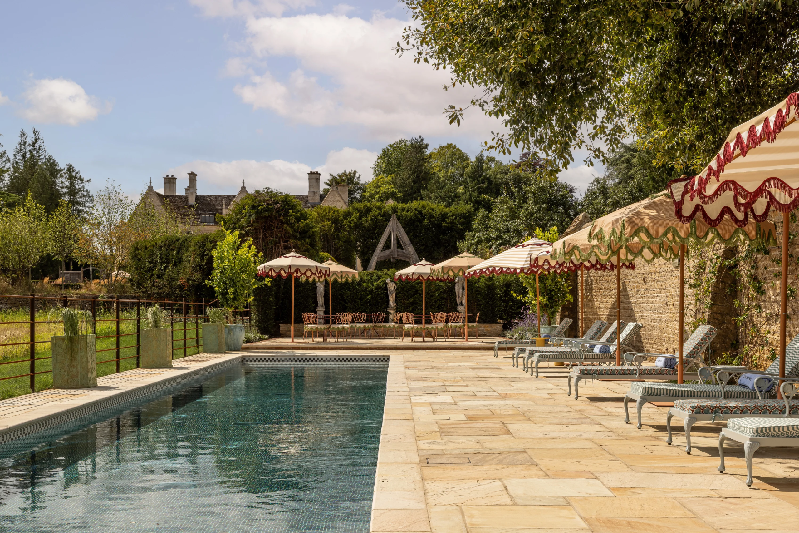 Kin House, a Grade II* listed Georgian manor wedding venue in Wiltshire with a design-led 21-metre outdoor pool 