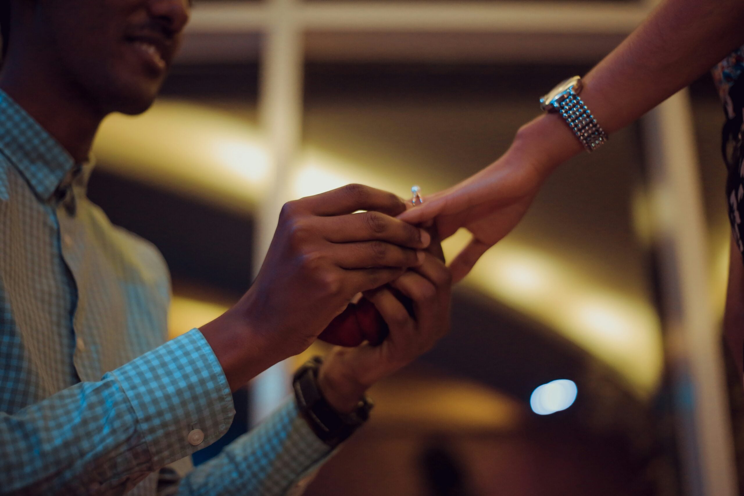 A man proposing with a diamond engagement ring