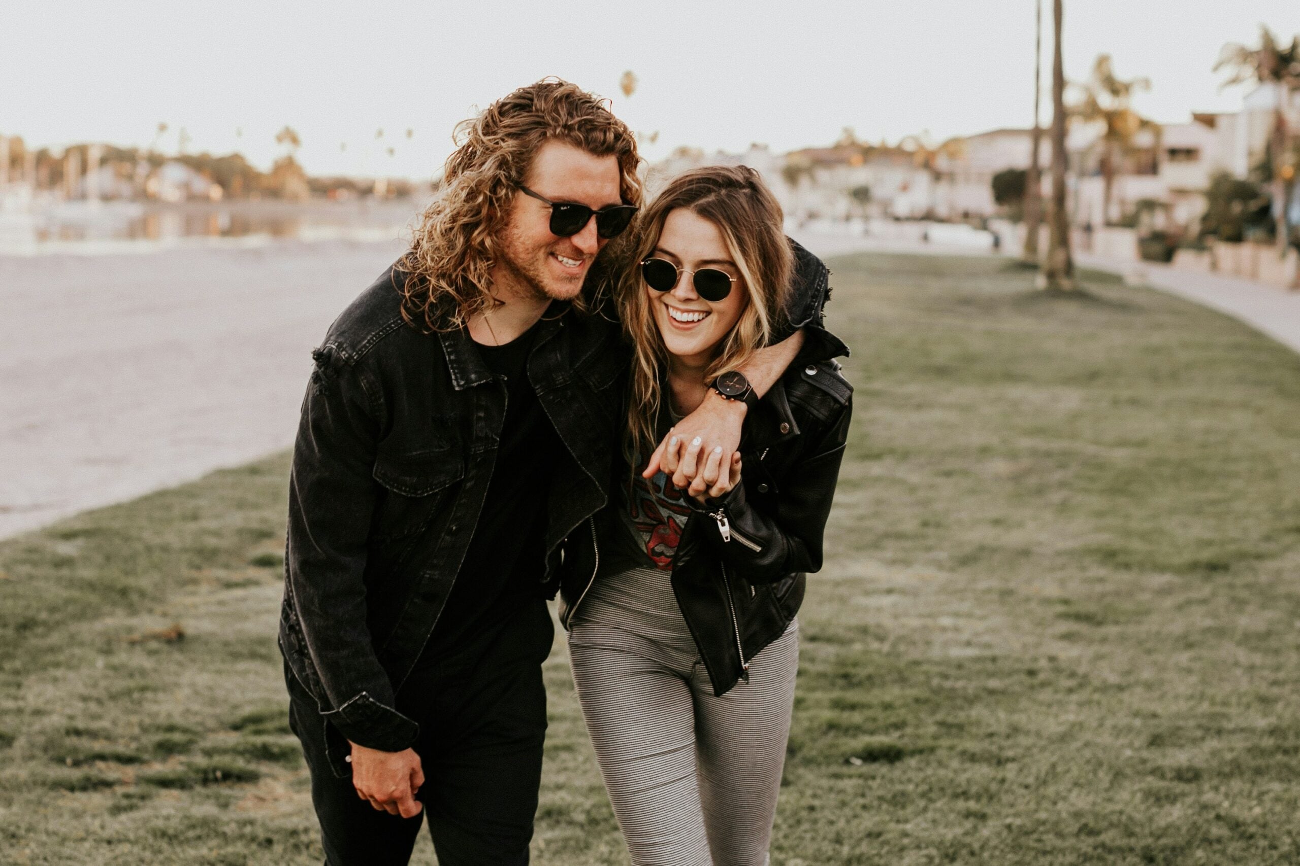 Couple smiling together wearing sunglasses